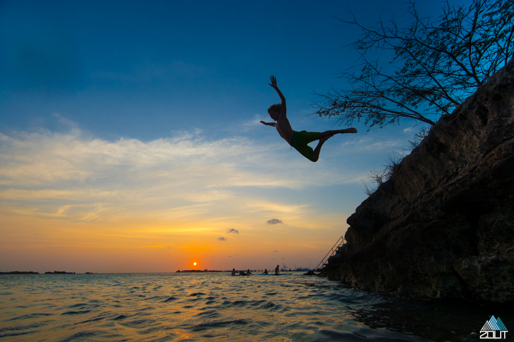 sunset jump ocean aruba